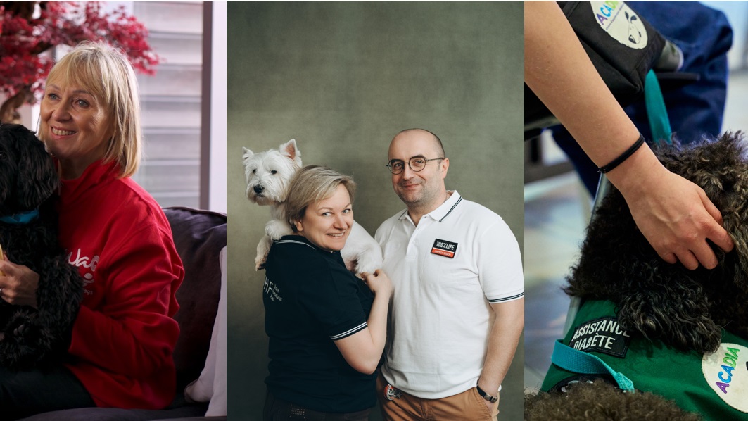 People are holding their pets in their arms