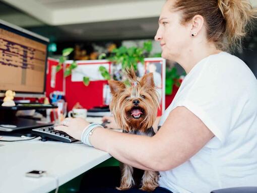 woman with dog at office