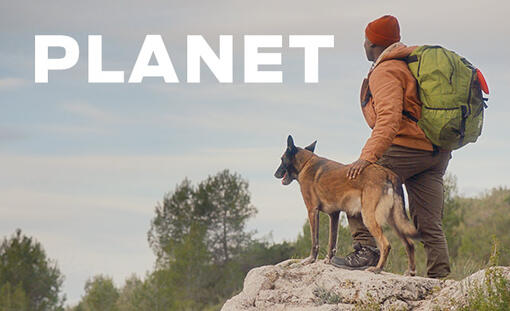 man hiking with his dog